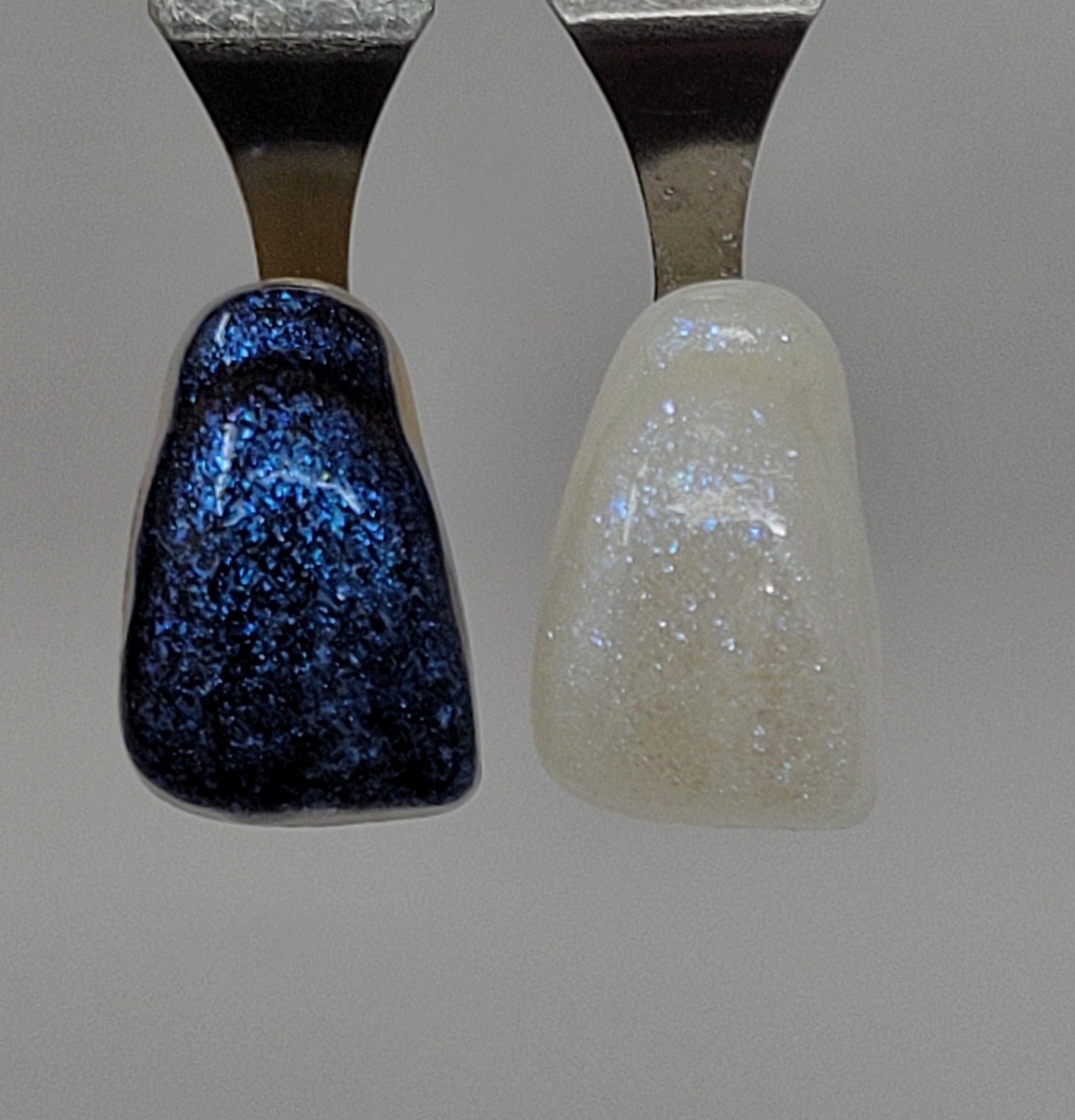 Blue Opal Temporary Tattooth Colorant on a demo tooth.  These colorants can be applied to teeth to temporarily alter their color or iridescence.