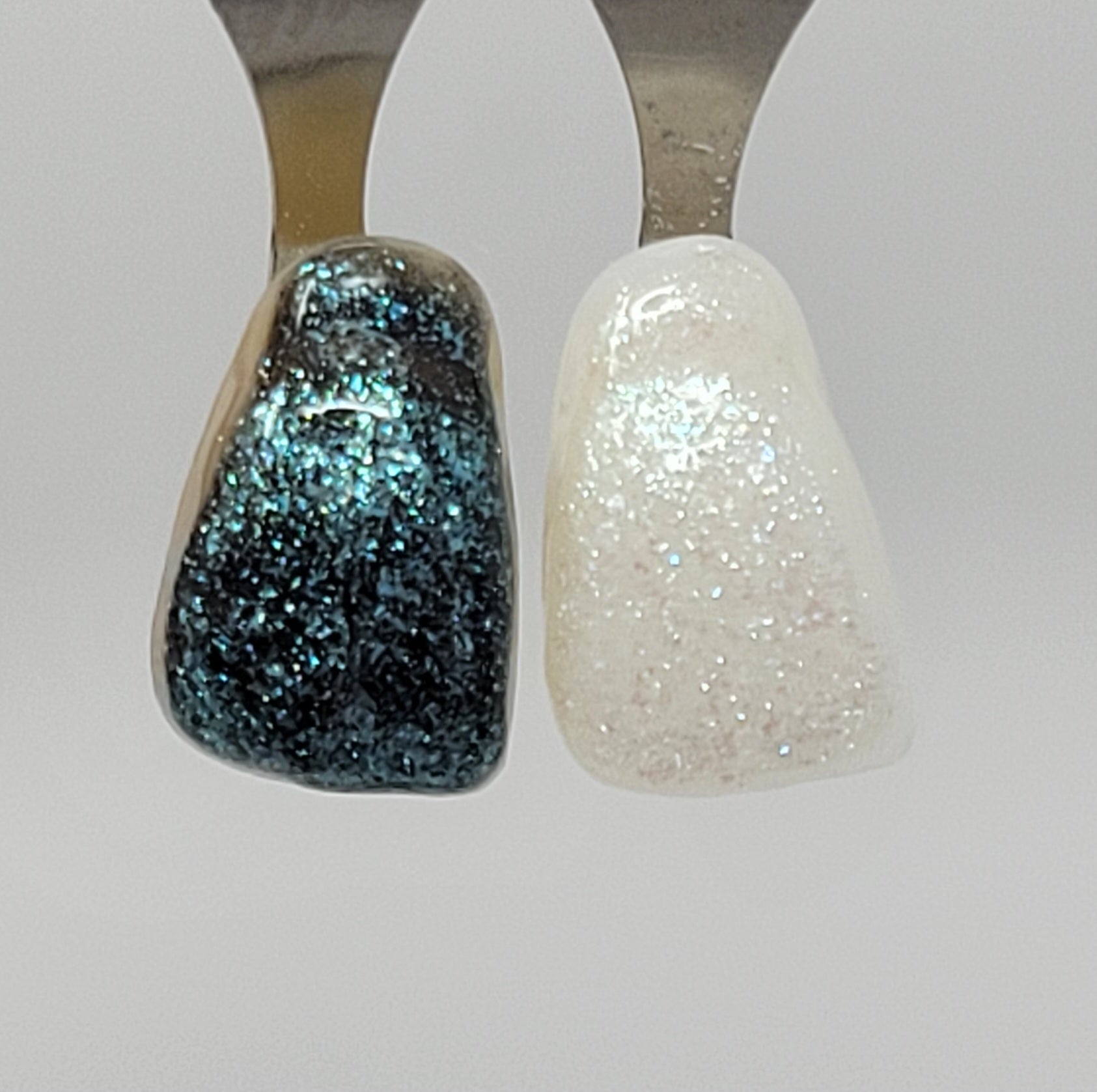 Green Opal Temporary Tattooth Colorant on a demo tooth.  These colorants can be applied to teeth to temporarily alter their color or iridescence.