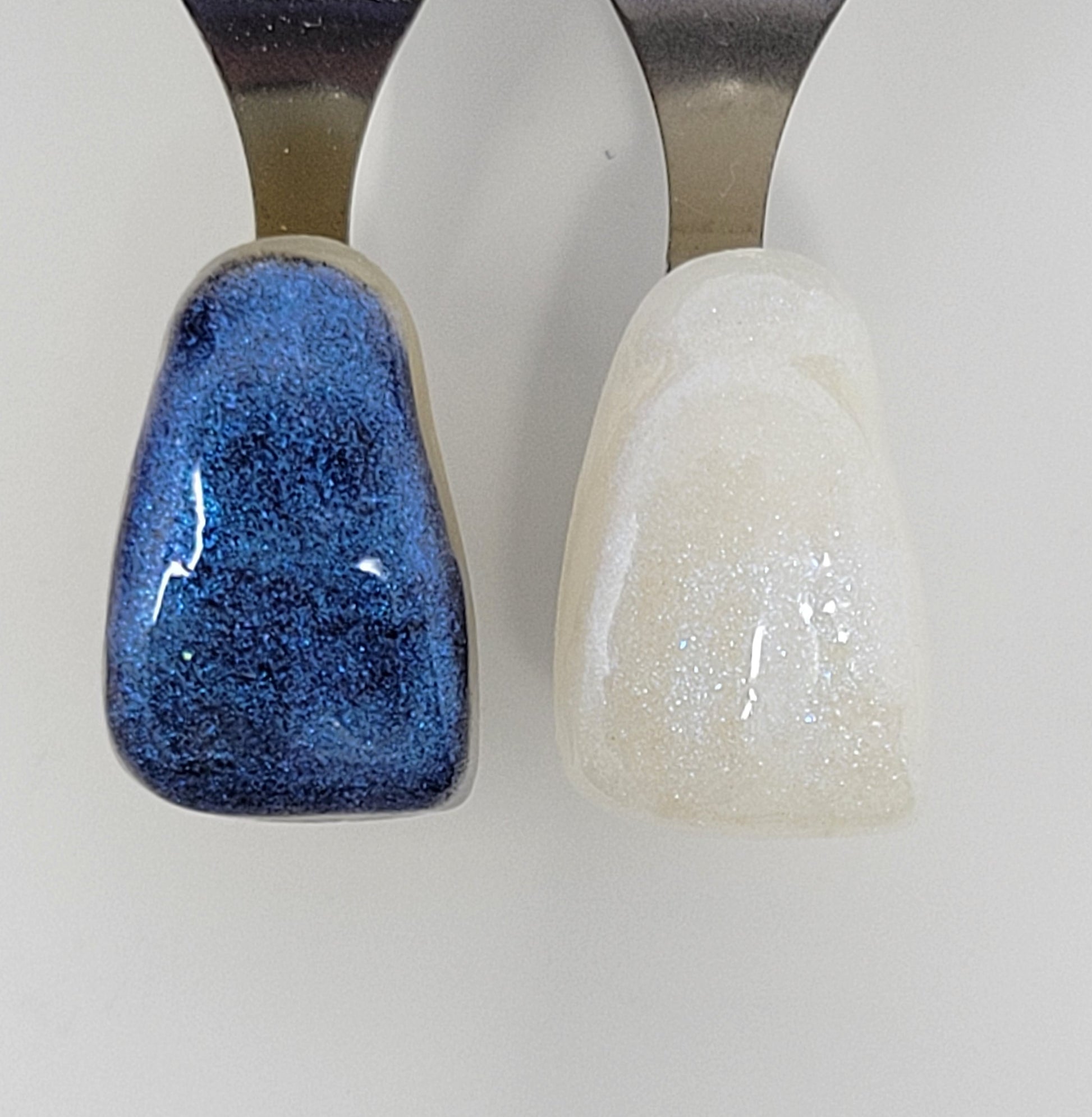 Light Blue Galaxy Temporary Tattooth Colorant on a demo tooth.  These colorants can be applied to teeth to temporarily alter their color or iridescence.