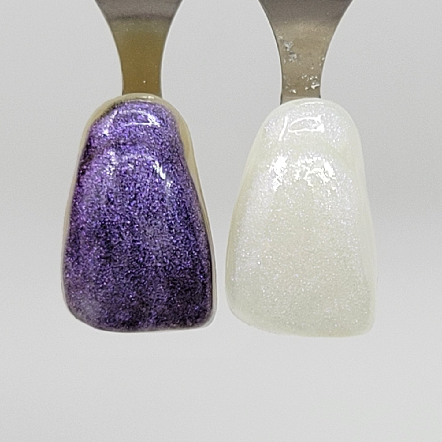 Purple Galaxy Temporary Tattooth Colorant on a demo tooth.  These colorants can be applied to teeth to temporarily alter their color or iridescence.