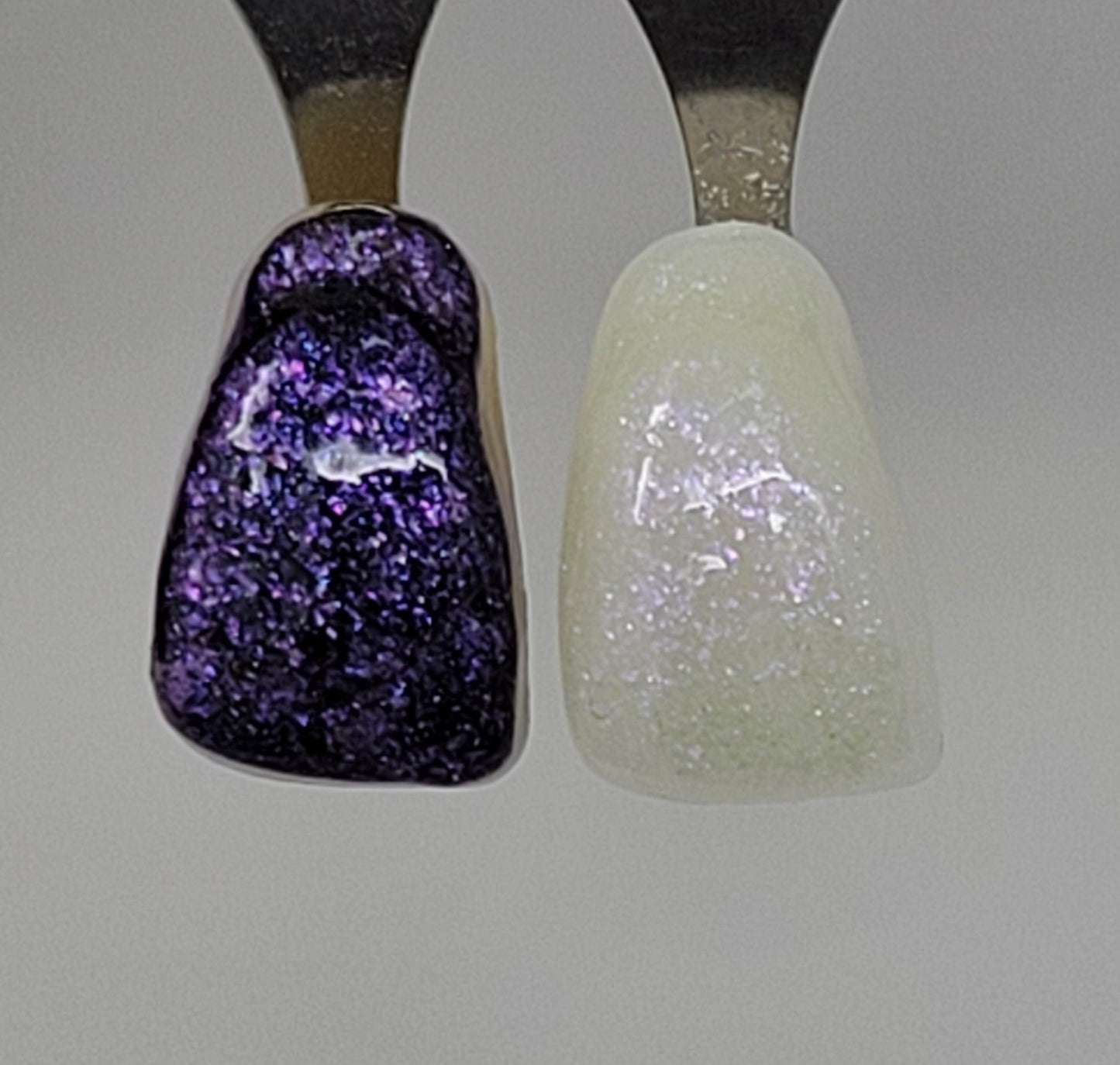 Purple Opal Temporary Tattooth Colorant on a demo tooth.  These colorants can be applied to teeth to temporarily alter their color or iridescence.