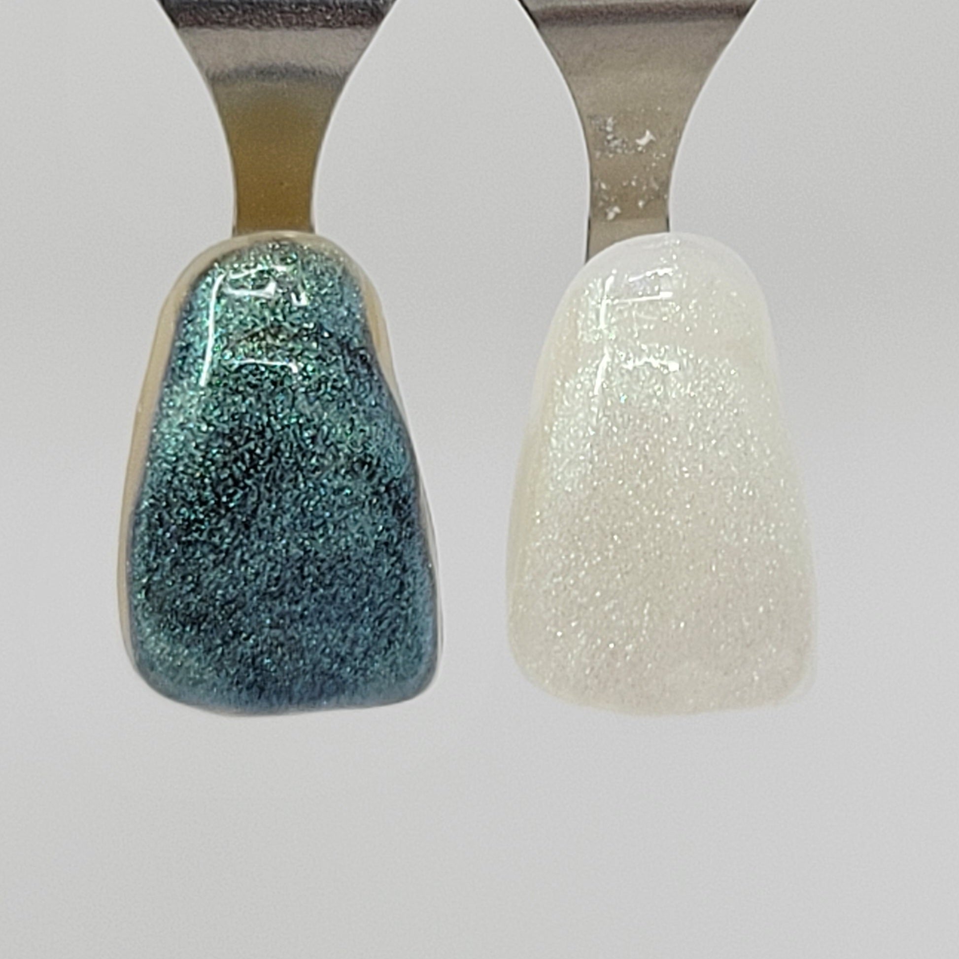 Turquoise Temporary Tattooth Colorant on a demo tooth.  These colorants can be applied to teeth to temporarily alter their color or iridescence.