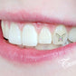 This is an image of a Temporary Tattooth.  It is a butterfly tooth tattoo with a small tooth gem attached to it's center.